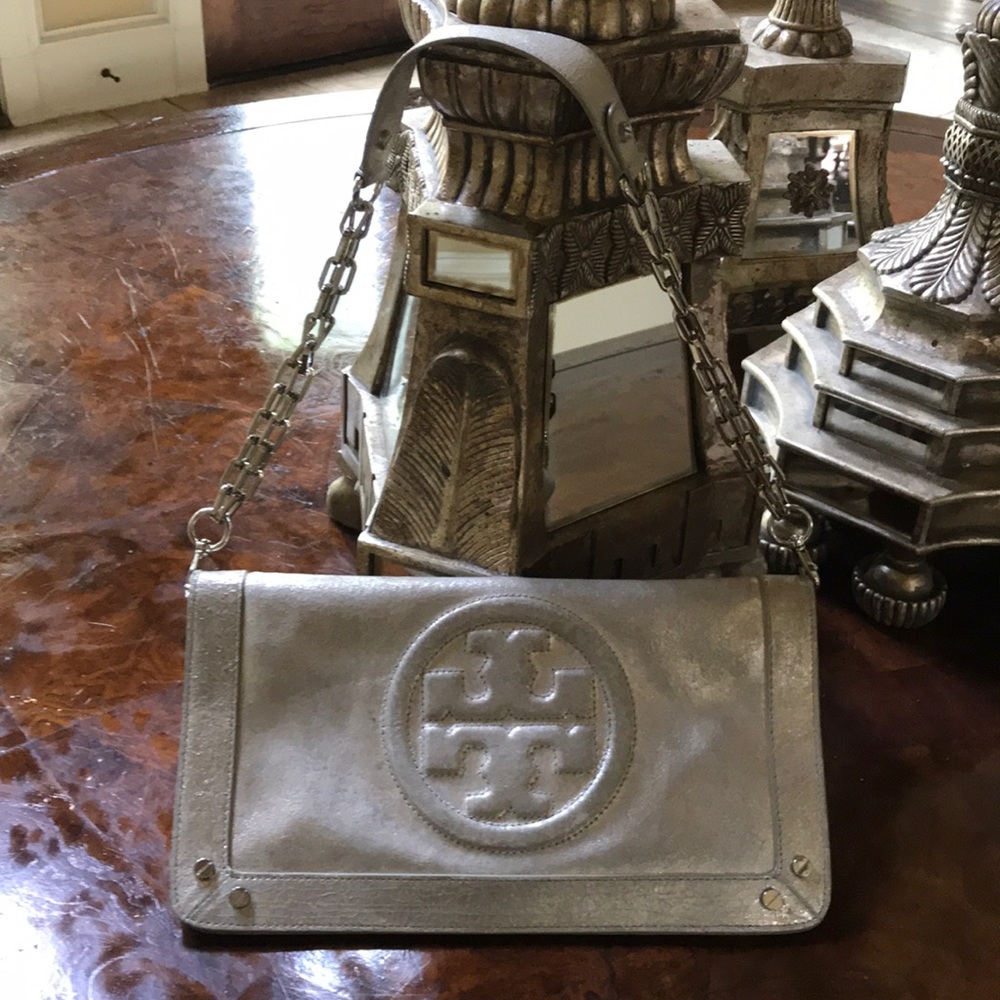 Tory Burch leather clutch with a removable strap.